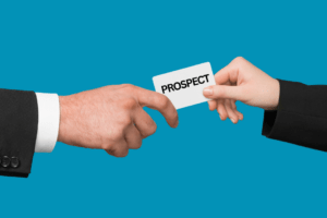 Two individuals handing off a home buying prospect showcasing the OSC handing off a lead to the onsite sales agent. 